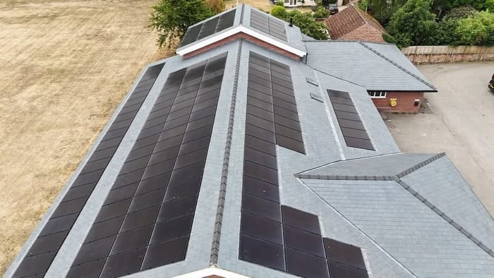 Aerial view of slate roof and solar panels at Nayland Village Hall