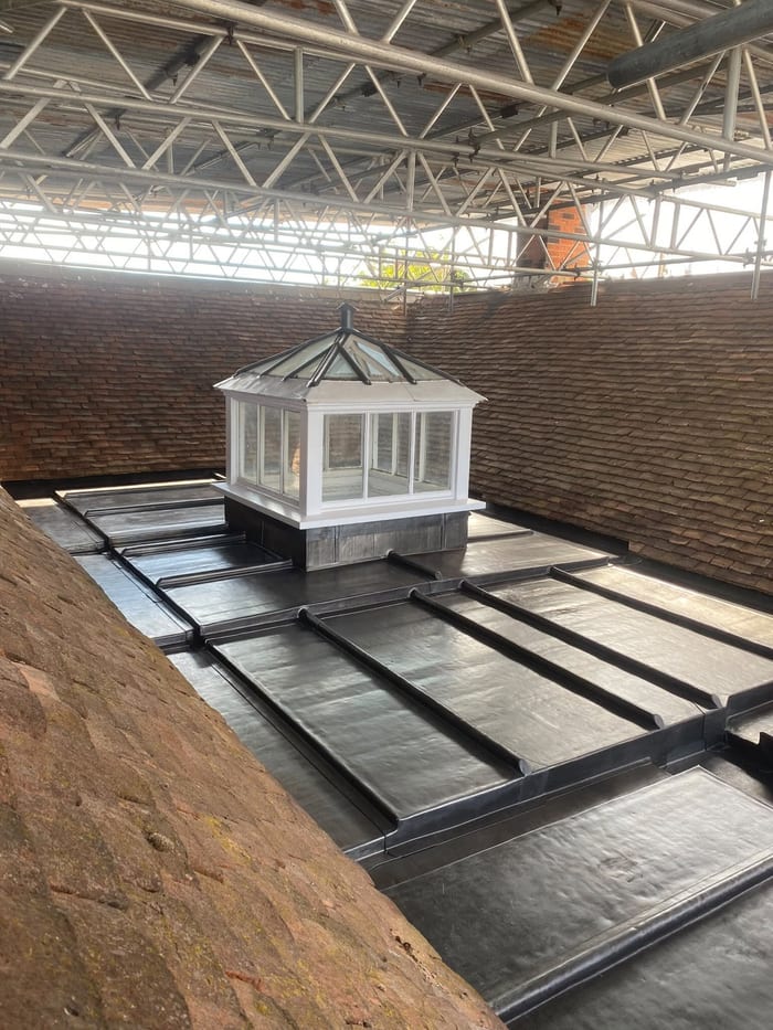 Lead roof panels surrounding a roof lantern